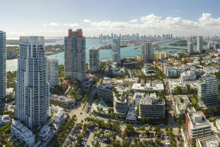 Miami Beach city American southern architecture. South Beach high luxurious hotels and apartment buildings. Tourist infrastructure in southern Florida, USA.